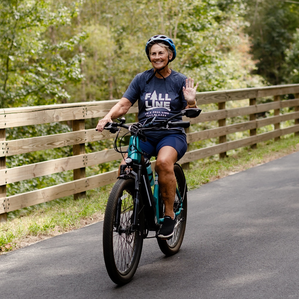 Smiling woman biking in Virginia