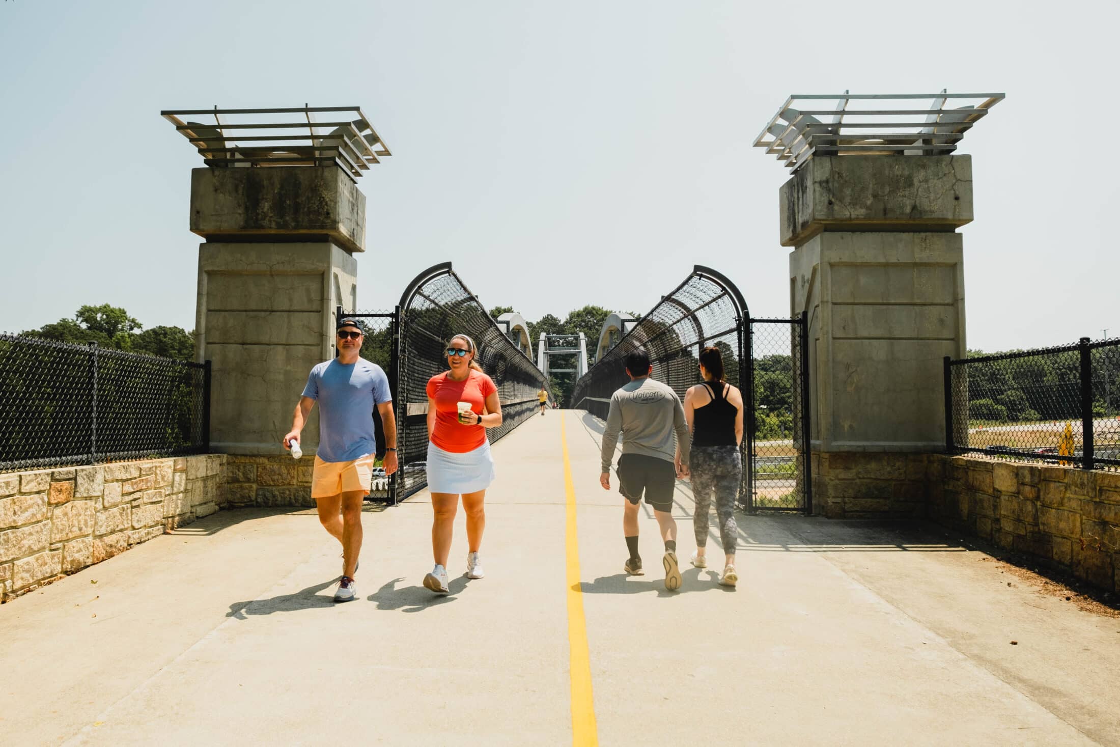 Pedestrians on the American Tobacco Trail bridge going over I-40