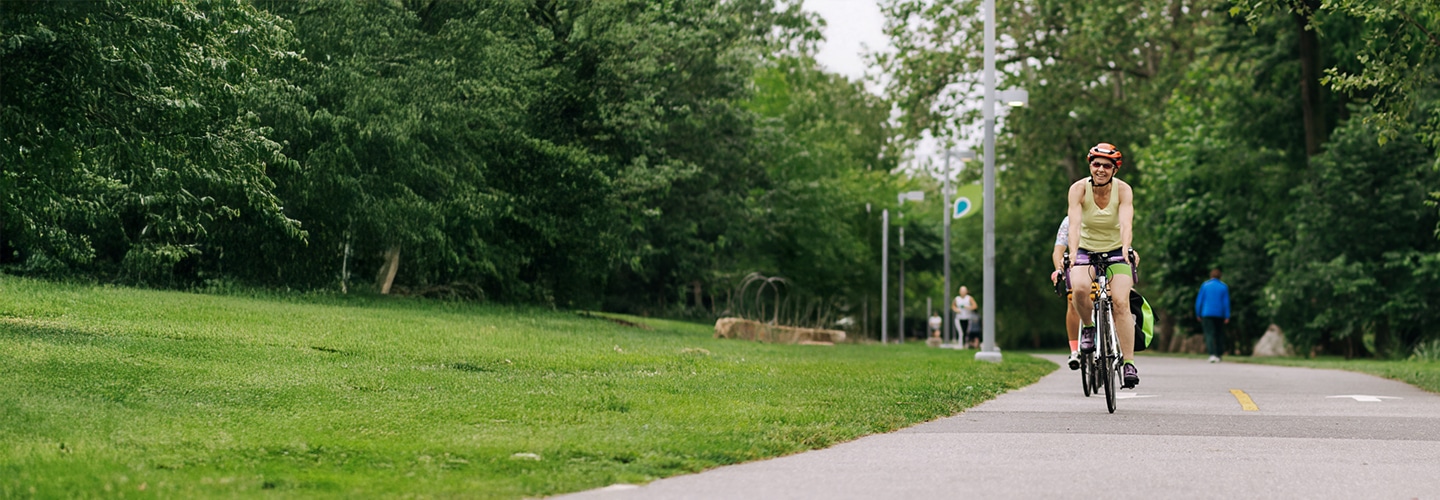 Woman cycling on the East Coast Greenway in Philadelphia
