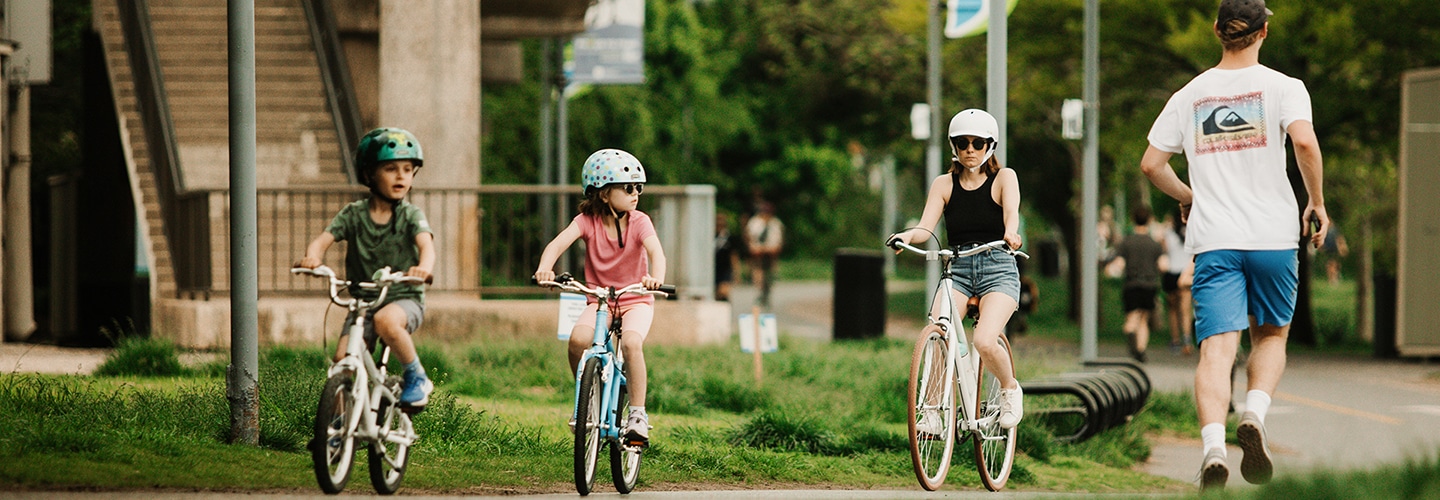 Mom and kids biking