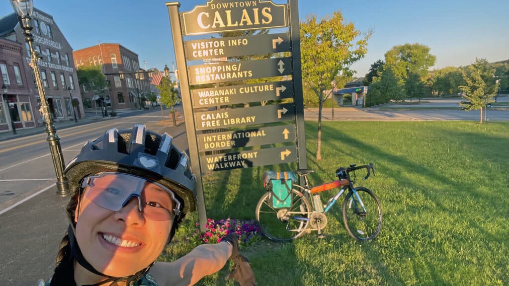 Woman biking in Calais Maine
