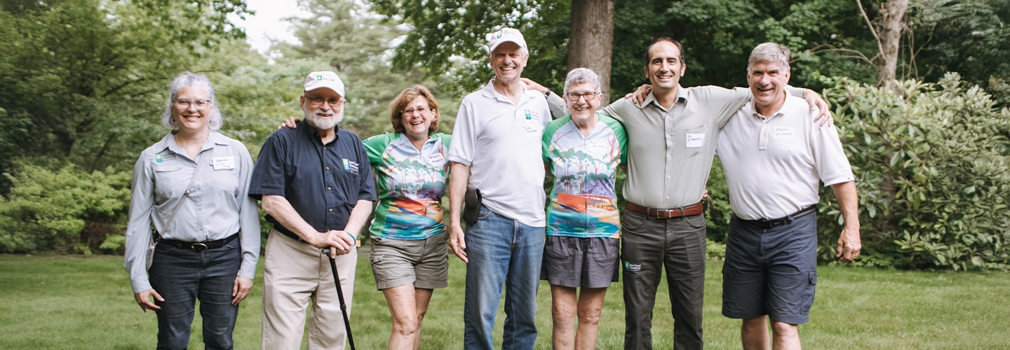 Long-time East Coast Greenway volunteers posing with staff members