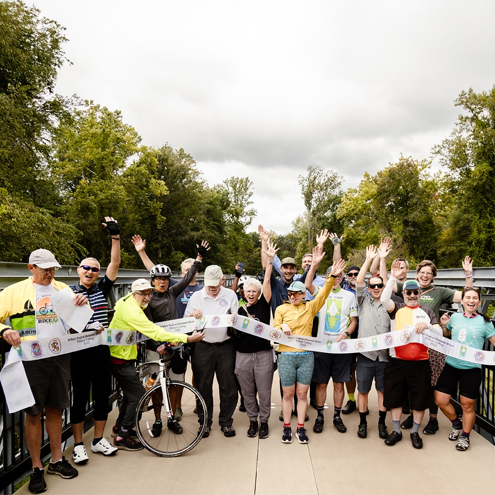 Advocates cheering on the Greenway at a ribbon cutting in Maryland