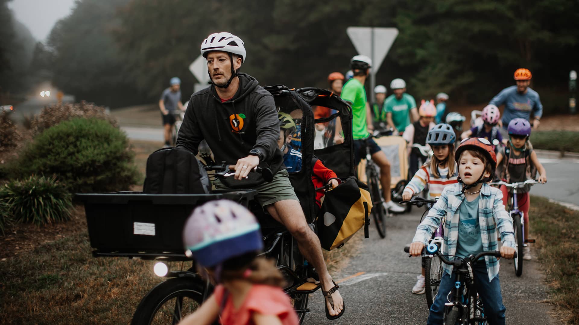 kids and parents biking to school