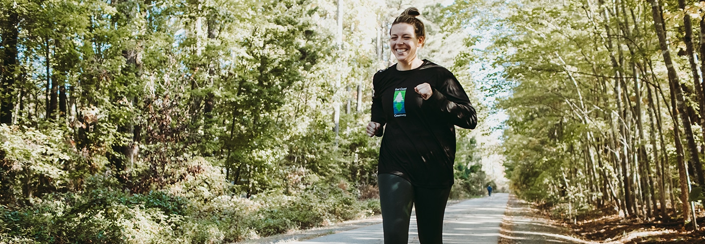 Woman running on trail