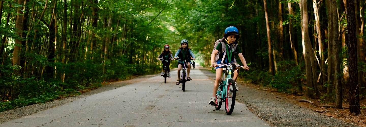 Children biking to school on the Greenway