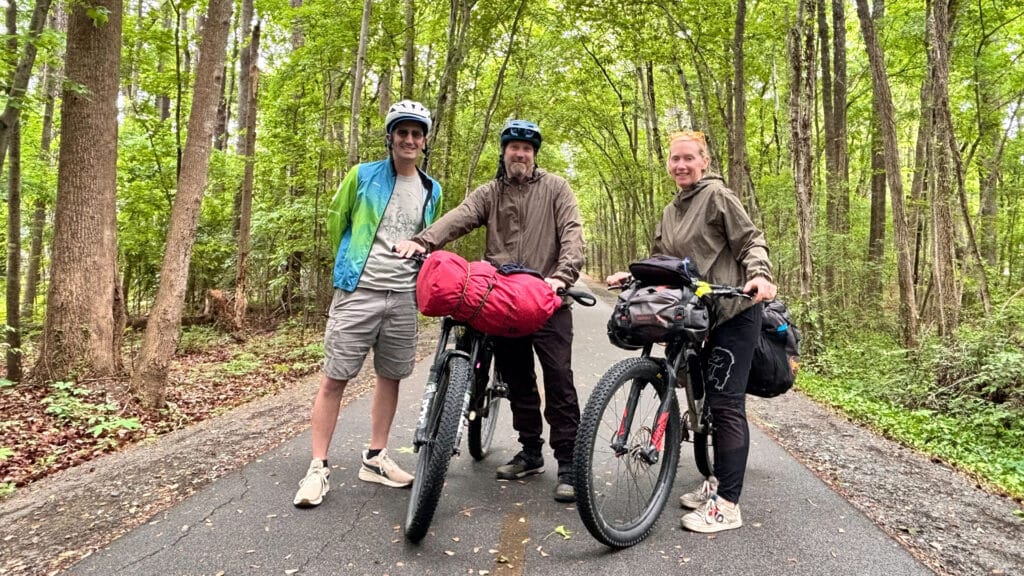 Three people smiling on the Greenway