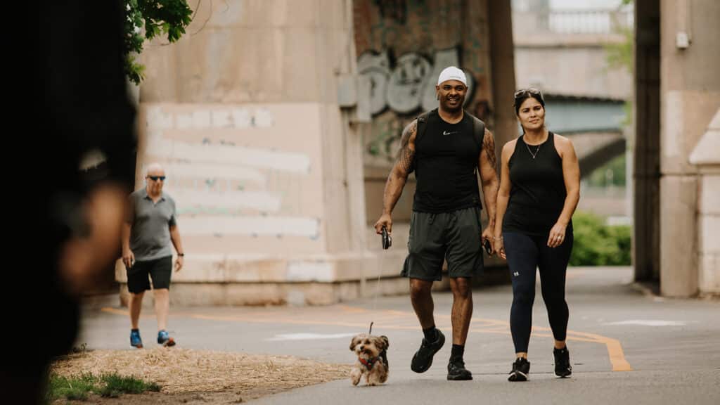 Smiling couple walking on the Greenway