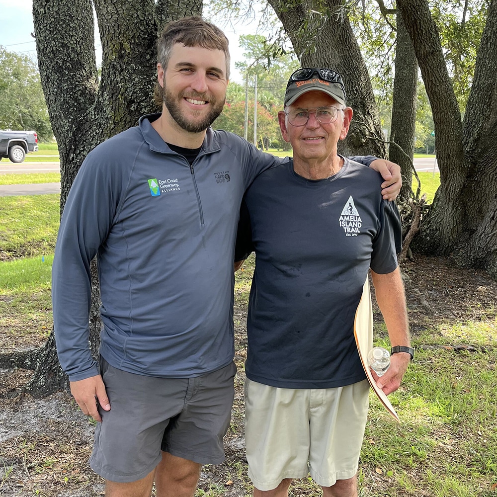 Two smiling men at Greenway celebration