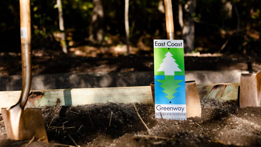 Greenway sign and shovel